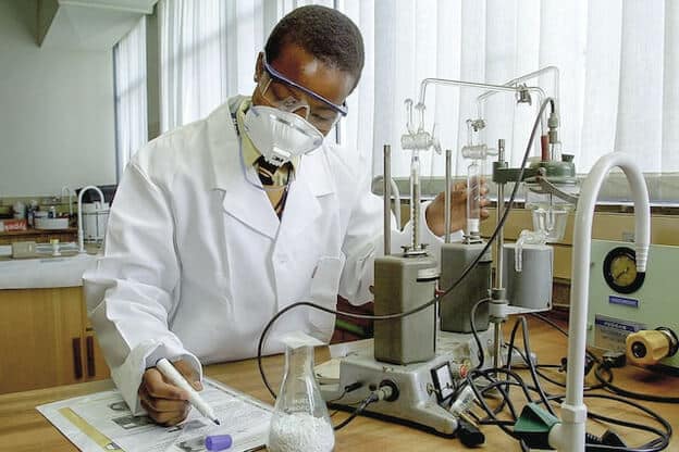 black science student with chemistry equipment