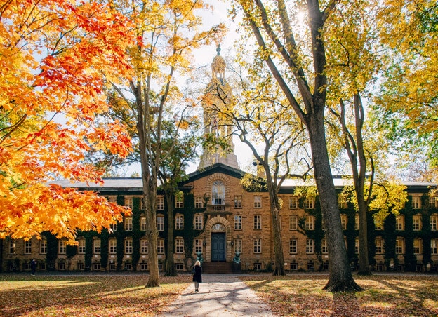 view of ivy league building with autumn leaves